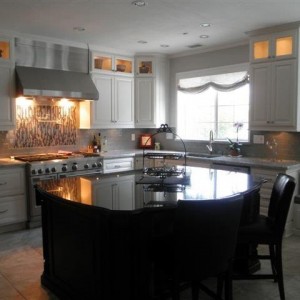 White kitchen cainets with stainless appliances