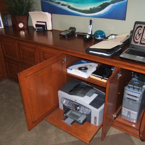 Put your printer on a pull out shelf in your home office